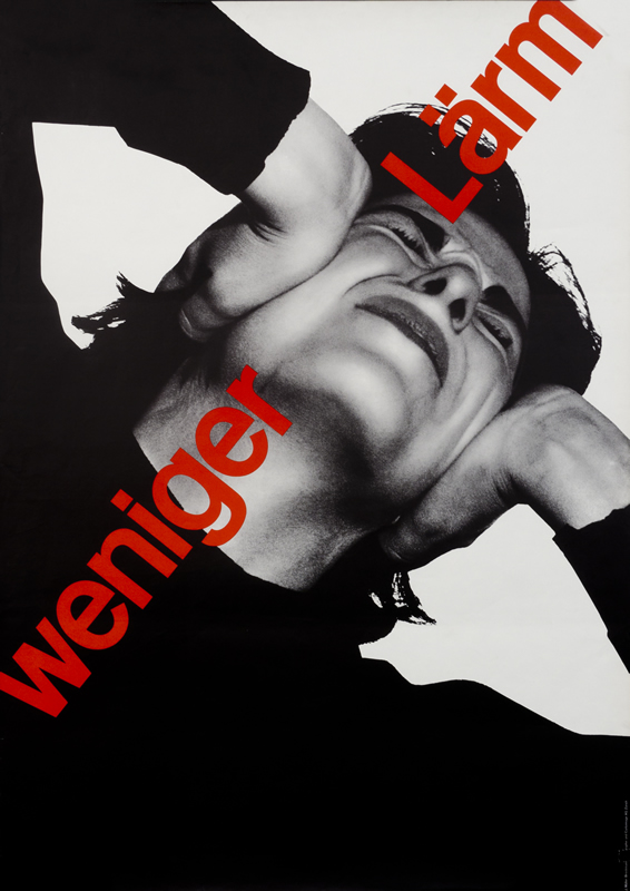 Woman holds her ears to block noise; black, white, red